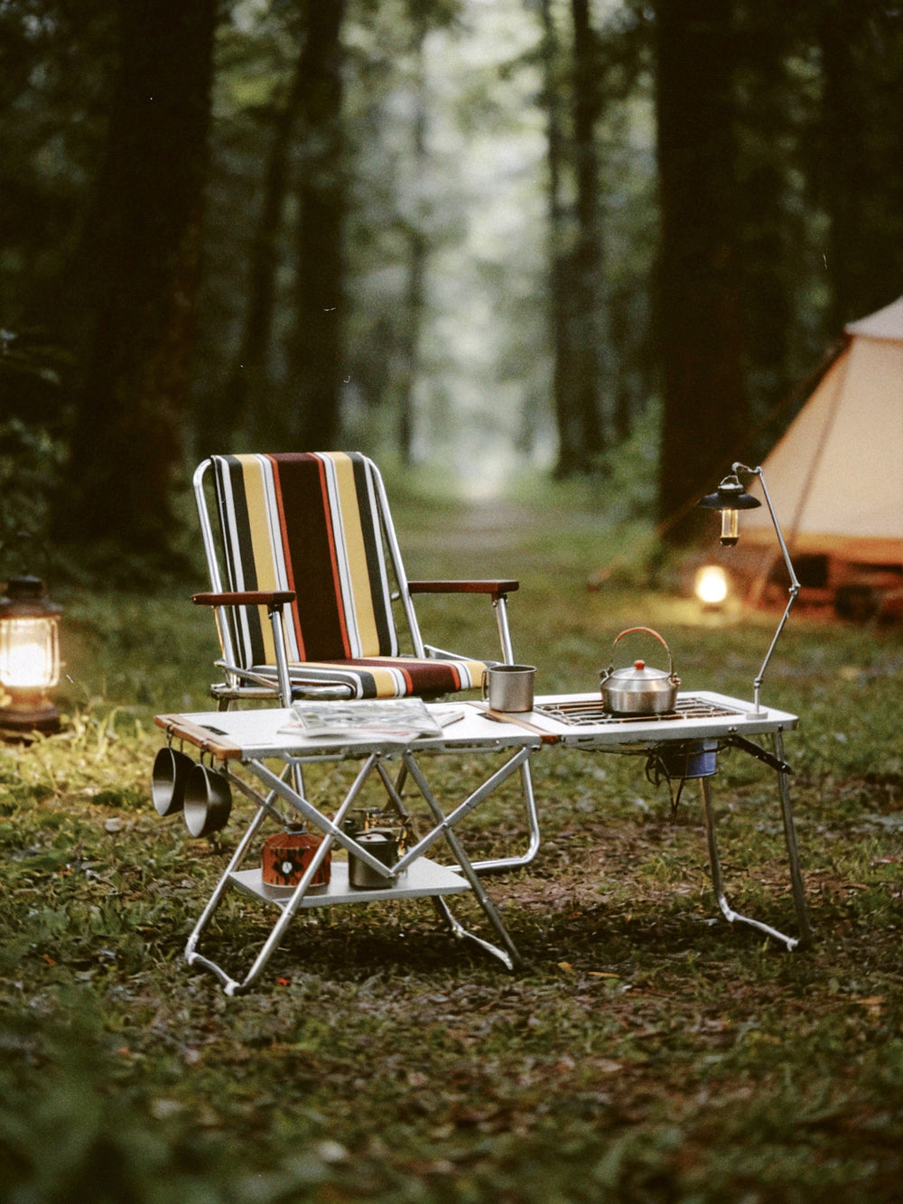 Onway Sports modular folding tables with a striped chair in a misty forest camp