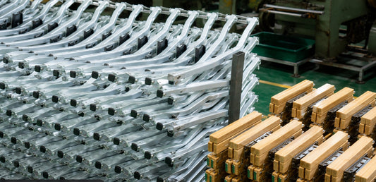 Aluminum chair frames and wooden armrests on the Onway Sports production line