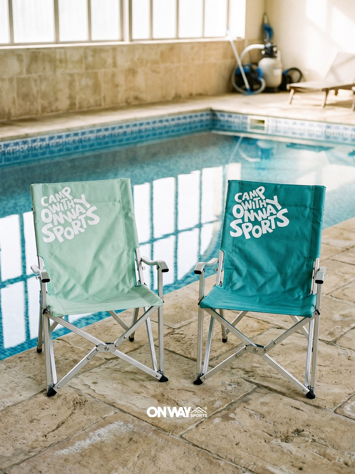 Mint and teal Onway Sports folding chairs beside a swimming pool